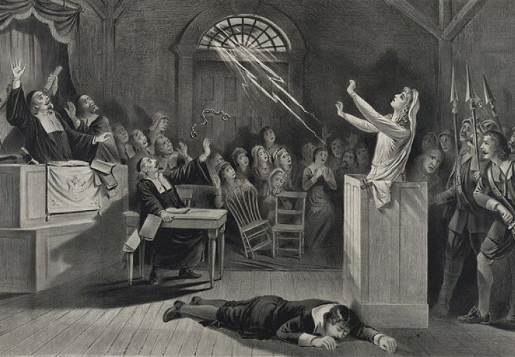 A bolt of lightning releases the handcuffs on a woman accused of being a witch and strikes down her inquisitor in this late nineteenth-century lithograph of a colonial-era trial.