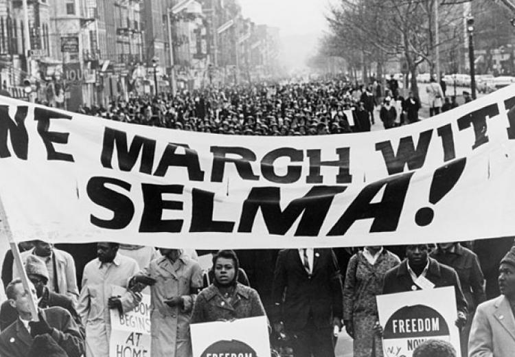 Marchers carrying banner "We march with Selma!" on street in Harlem, New York