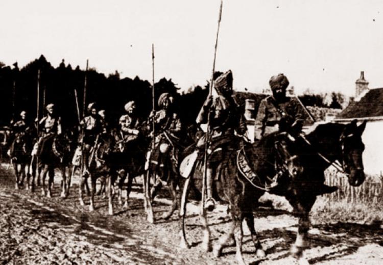 Sikh patrol passing through a village. From "The New York Sun," January 10, 1915