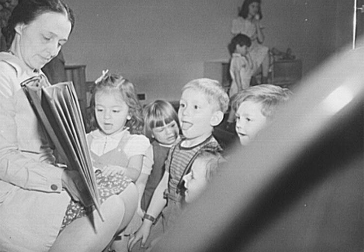 World War II-era (1943) Buffalo, New York nursery school children react to Mother Goose during morning play period.