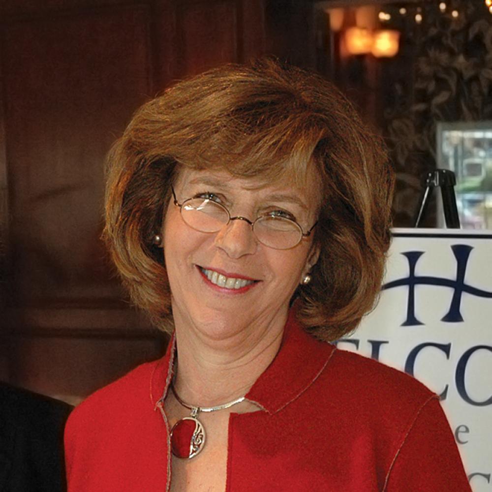 photograph of a woman in red jacket