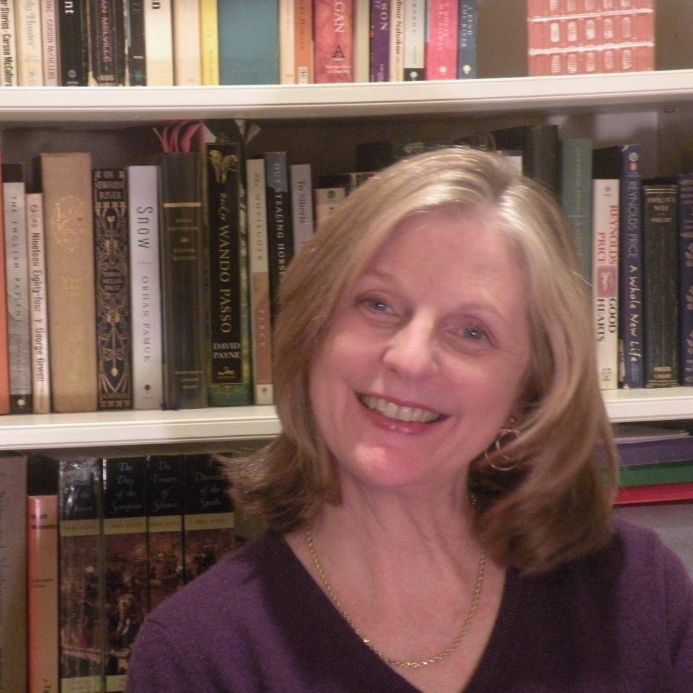 Crisp in front of bookshelves