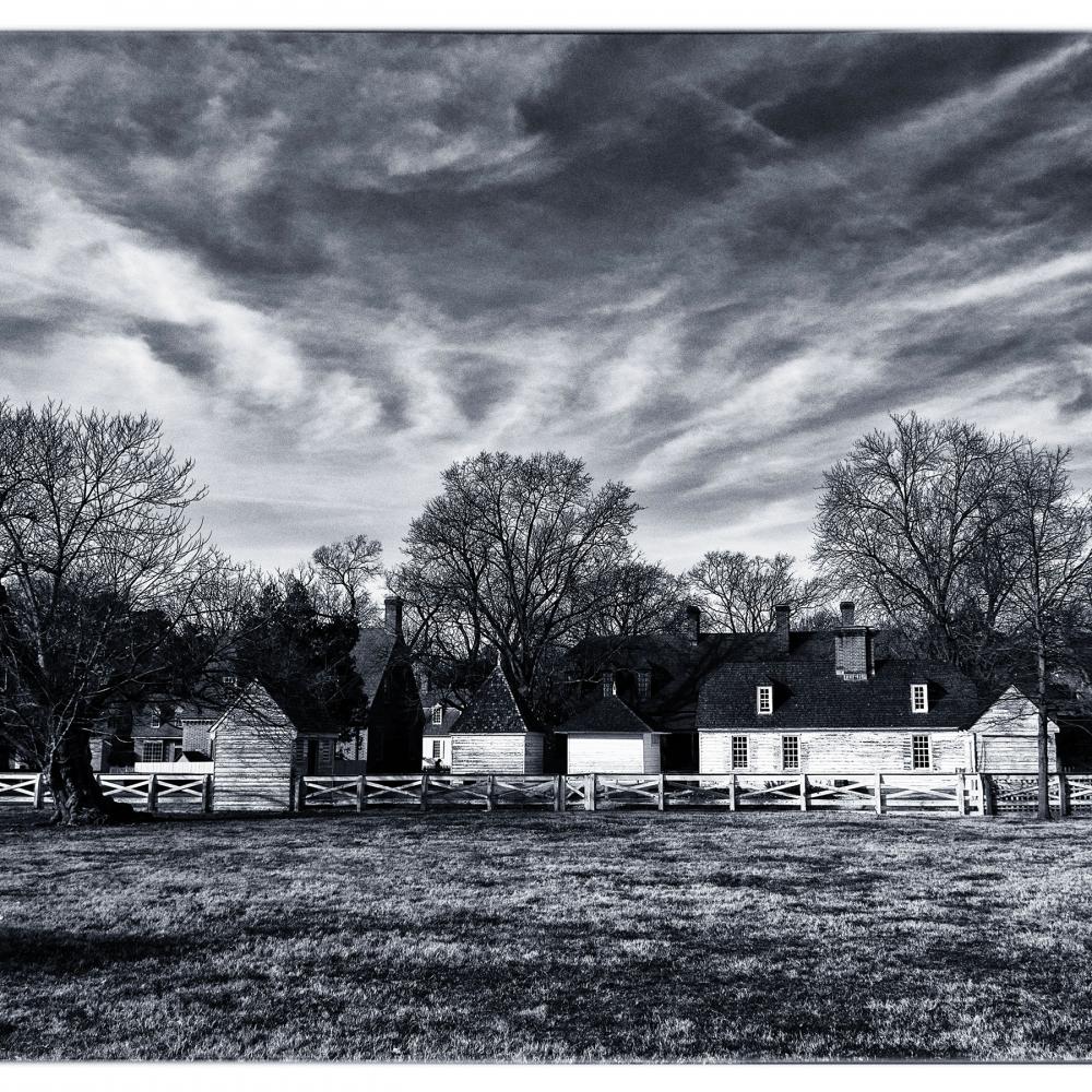 Old Williamsburg homes, under a cloudy sky