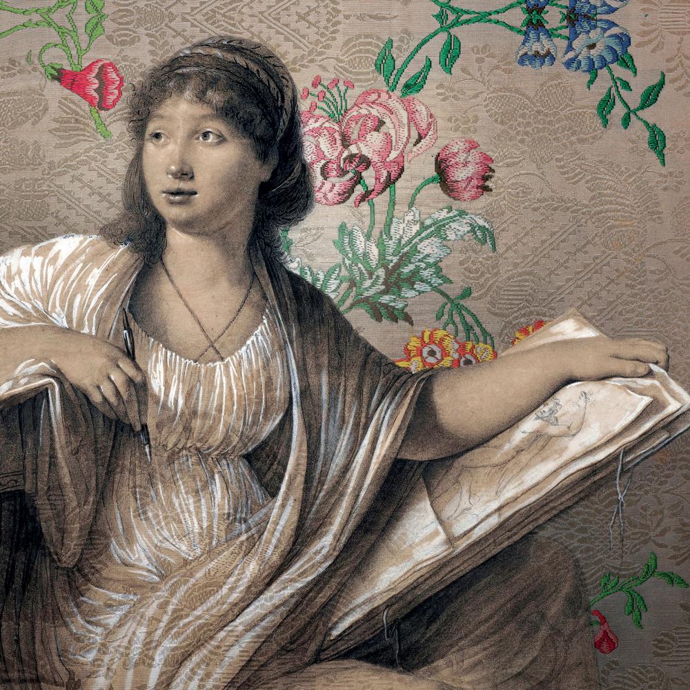 Girl holding a drawing before a floral wall