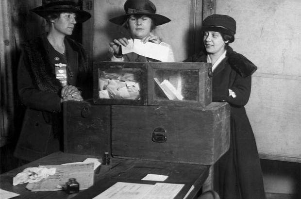 Three suffragists casting votes in New York City, 1917.