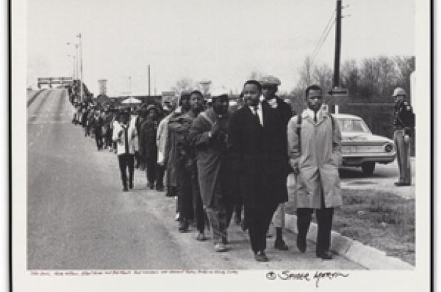 Photograph of protesters marching at Edmund Pettus Bridge