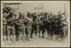 WWI American soldiers examining their new rifles after turning in the old ones