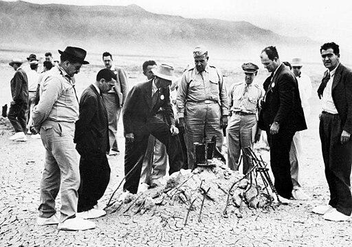 J. Robert Oppenheimer and General Leslie Groves at the ground zero site of the Trinity test.