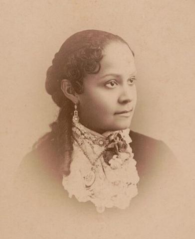 Sepia-toned portrait of Fannie Barrier Williams looking just off-camera