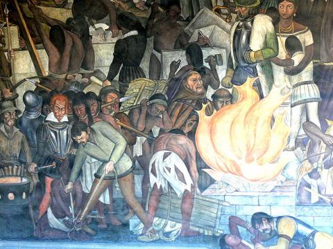 A segment of Diego Rivera's mural in the Palacio Nacional (Mexico City), depicting the burning of Maya literature by the Catholic Church.