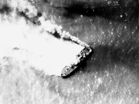 A North Vietnamese Shantou-class gunboat burns near Hon Ne Island