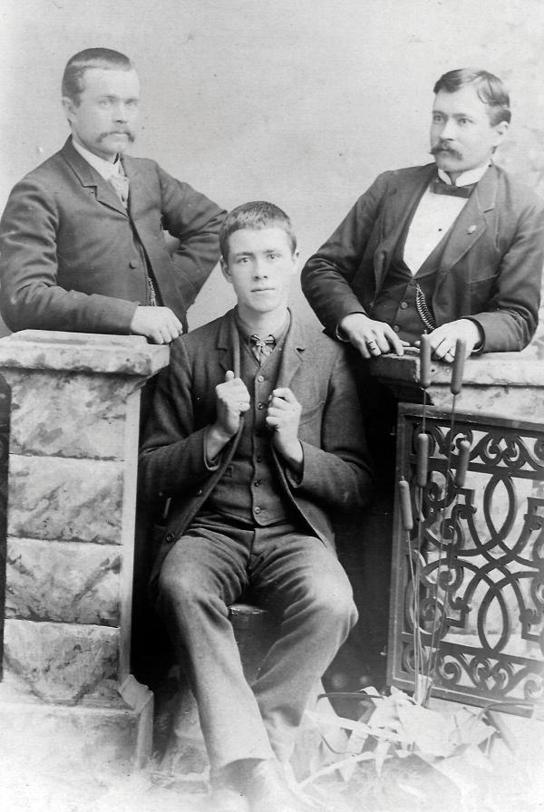 black and white photo of three brothers,19th century.