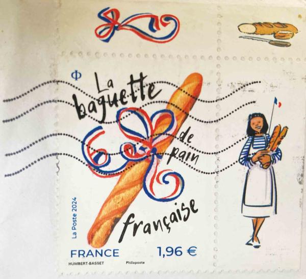 Photograph of a French postage stamp with images of baguettes on it