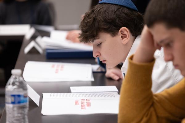 photograph of student reading booklet 