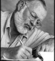 Hemingway, leaning on an elbow and writing with a pen, head tilted, wearing eyeglasses