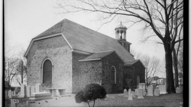A black and white photo of Old Swedes church.