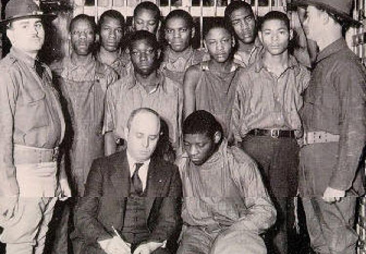 The Scottsbro Boys, with attorney Samuel Leibowitz, under guard by the state militia, 1932