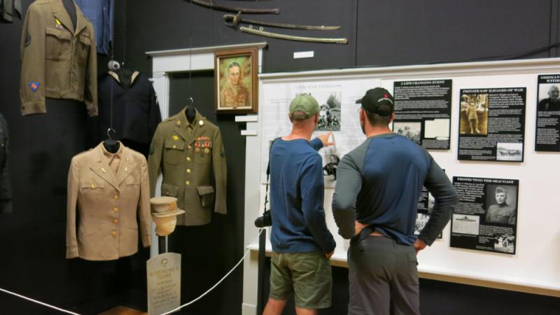 Two visitors enjoying the military exhibit.