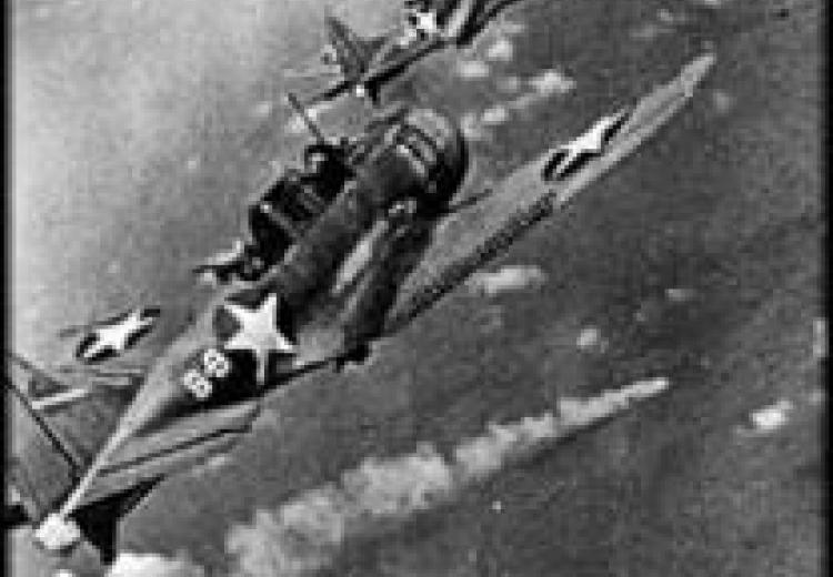 Black and white photo of two American dive bombers in formation