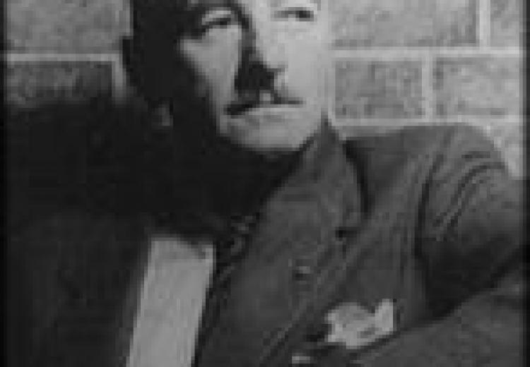 Black and white photo portrait of William Faulkner.