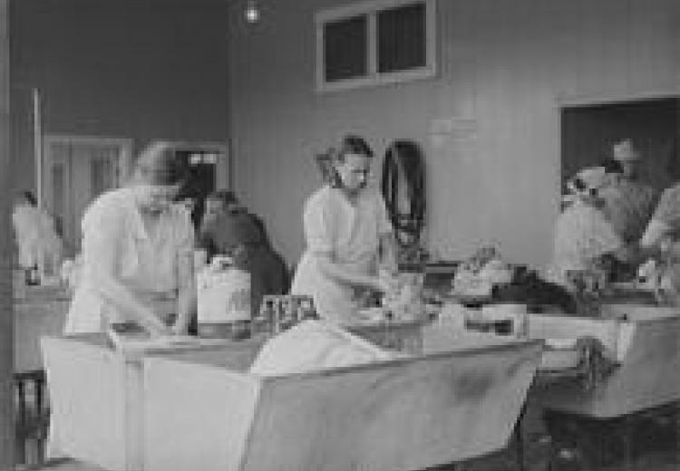 Women washing clothes at Tulare migrant camp
