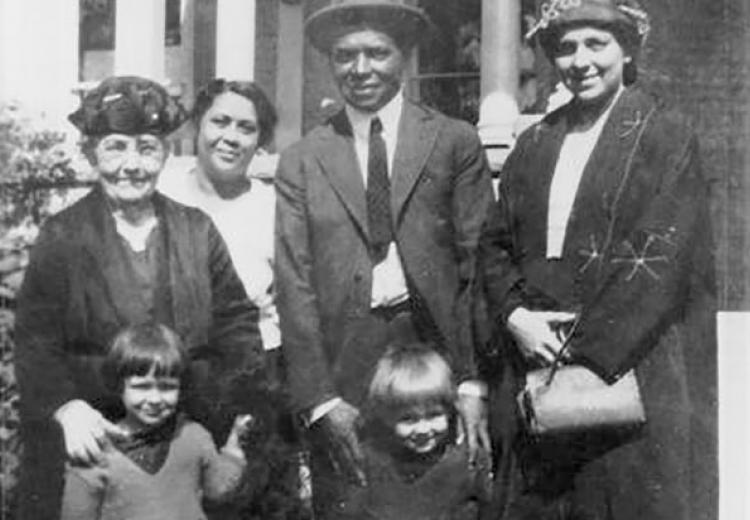 Photograph showing six people, including Charles Young