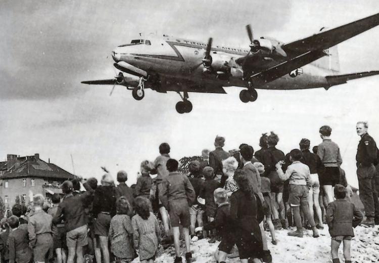 Berliners watching a C-54 land at Berlin Tempelhof Airport, 1948