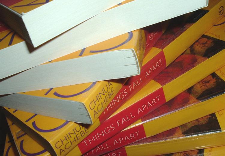A spiral stack of copies of the 1994 Anchor Books edition of Chinua Achebe's novel Things Fall Apart.