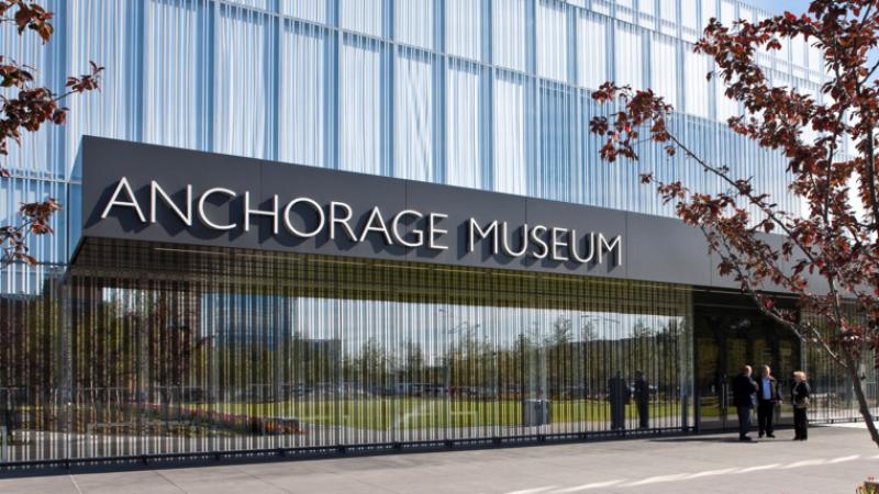 Image of digital rendering of the Anchorage Museum entryway, with a glass building that says "Anchorage Museum"