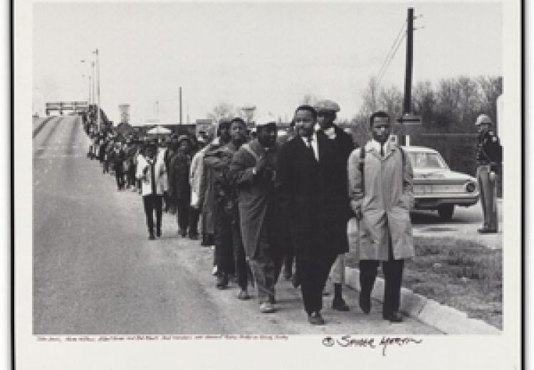 Photograph of protesters marching at Edmund Pettus Bridge