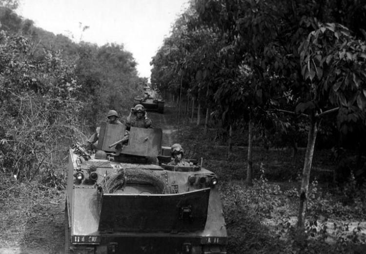 Tanks deploy between jungle and rubber plantations in Operation Cedar Falls during the Vietnam War. 