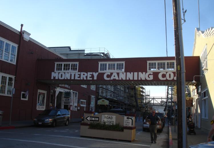 Covered pedestrian bridge labeled Monterey Canning Co.