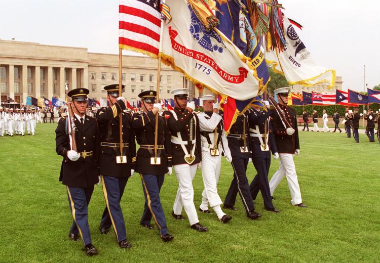 Joint Service Color Guard passes in review before a large audience of Department of Defense officials and guests during the 50th Anniversary of Armed Forces Day ceremony at the Pentagon on May 18, 2000.
