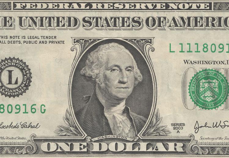 Portrait of President George Washington on a one dollar bill.