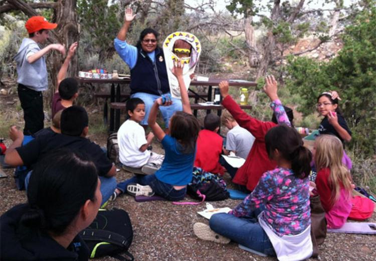 Students learning about Ute cultural artifacts.