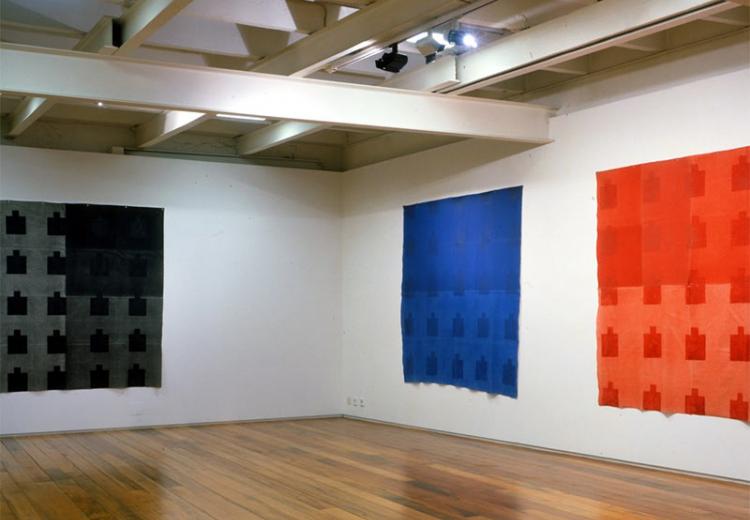 This photograph shows three works from the 'Matisse, Rothko, and Reinhardt' series by artist Víctor Pires Vieira.