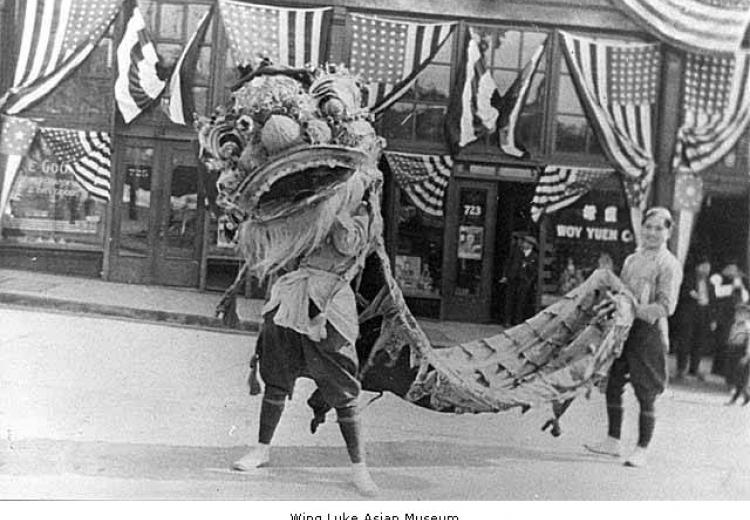 1921 Chinese lion dance in front of the East King Yick Building.  