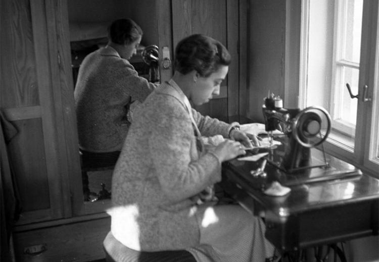 Woman at sewing machine, 1937.